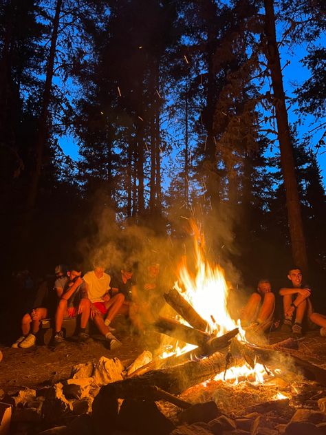 a group of people sitting by the fire on an island Summer Camp 1980s, Slasher Summer Camp Aesthetic, 1970s Summer Aesthetic, Summer Camps Aesthetic, Haunted Summer Camp, American Camp Aesthetic, Summer Camp Slasher Aesthetic, Summer Camp Vintage, Slasher Summer Camp