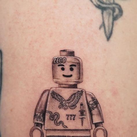 Michael Alvarez on Instagram: "@lego 🗡️ This was about 2.5 inches tall 👌🏼 Thanks Devin!  #lego #legominifigures #legotattoo #smalltattoo" Matching Lego Tattoo, Lego Skull Tattoo, Lego Tattoo Ideas For Men, Lego Man Tattoo, Starwars Lego Tattoo, Lego Tattoo Ideas, Lego Tattoo, Soldier Tattoo, Lego Toy