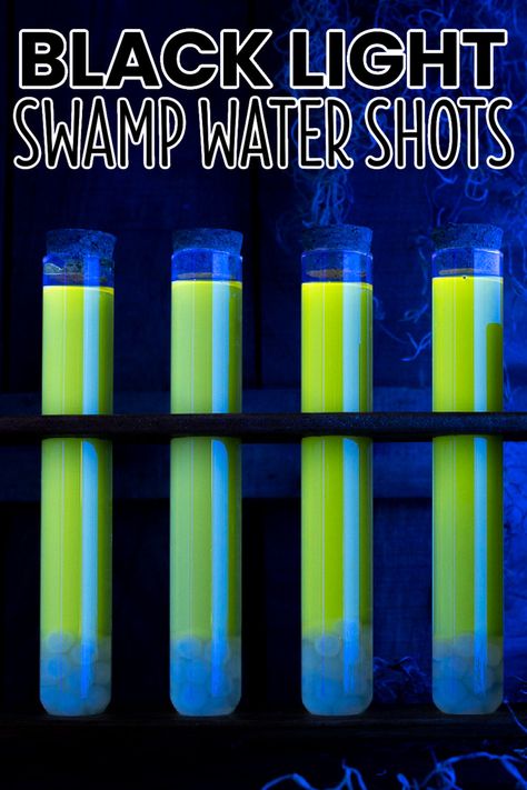 So creepy and delicious, Black Light Swamp Water Shots are a darkly glowing, spooky drink to serve all undead guests and a few witches too! #BreadBoozeBacon #testtube #shots #testtubeshots #strawberry #lemon #rum #cocktail #halloween #halloweencocktails #halloweenparty Test Tube Shots Halloween, Halloween Boba Drink, Glowing Cocktails, Halloween Shots Recipes, Light Alcoholic Drinks, Halloween Shooters, Zombie Drink, Fruity Shots, Test Tube Shots