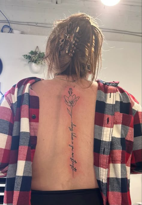 Flower And Words Spine Tattoo, Resilience Spine Tattoos For Women, Quote And Flower Spine Tattoo, Floral Spine Tattoo With Quote, Flower And Word Tattoo, Flower Word Spine Tattoos For Women, Spine Tattoo Flower, Spine Script Tattoo, Cursive Spine Tattoo