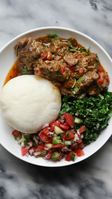 Kenyan Goat Wet Fry, Sukuma Wiki, Kachumbari and Ugali - Travelandmunchies Kenyan Recipes Dishes, Kachumbari Recipe, Ugali Recipe, Kenyan Meals, Jamaican Dinner, Kenyan Recipes, South American Food, American Food Recipes, Filling Meals