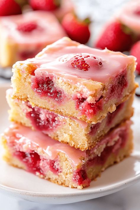 Strawberry Lemon Blondies are a delicious treat that beautifully balances the sweetness of strawberries with the zesty brightness of lemons. These soft, chewy bars are ideal for any occasion! Unlike cookies, bars and brownies are quicker to make and are the perfect dessert to bring to gatherings. This Strawberry Lemon Blondie recipe is bursting with Lemon Strawberry Recipes, Strawberry Shortbread Bars, Strawberry Lemon Brownies, Strawberry Lemon Cookies, Strawberry Lemon Bars, Strawberry Lemon Blondies, Strawberry Blondie, Lemon Blondies, Chewy Bars