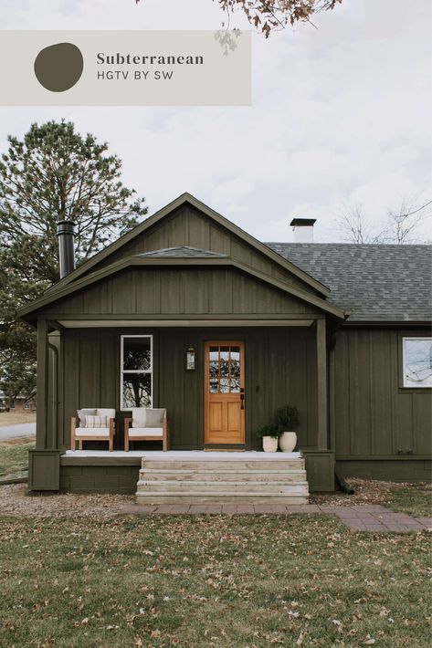 "Subterranean" from HGTV by Sherwin Williams on the exterior siding. Exterior paint color inspiration. Hunter green paint color ideas for interior or exterior. Cabin inspired exterior paint color by Nadine Stay | #subterranean #hgtvbysherwinwilliams #sherwinwilliams #paintcolorideas #exteriorpaintcolors #exteriorcolorinspiration #huntergreenpaintcolors #cabinpaintcolors House And Trim Same Color Exterior, Green Board And Batten Exterior, Green Cabins, Home In Woods, Nadine Stay, Cedar Shingle Siding, Green House Exterior, Green Cabin, Board And Batten Exterior