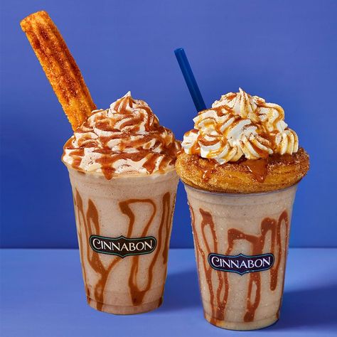 CINNABON’S NEW FROZEN CHURRO CHILLATA IS TOPPED WITH WHIPPED CREAM, CARAMEL, AND A CHURRO | Now you just have to choose: Churro Swirl or Churro Stick? Churreria Ideas, Caramel Whipped Cream, Churro Donuts, Chocolate Frosty, Frosty Recipe, Lunch Restaurant, Cinnamon Twists, Caramel Drizzle, Fast Food Items