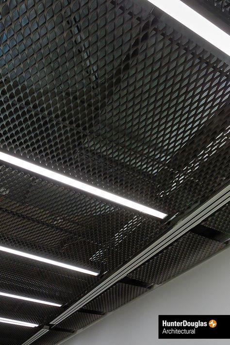 Stretch Metal Ceiling. Our focus on quality ensures the highest standard of production processes, material, machinery and finished product. The superior durability of Hunter Douglas products translates into lower costs during the life cycle of the product. #architecture #architect #ceiling #hunterdouglas Stretch Metal Ceiling, Mesh Ceiling Design Interiors, Lower Ceiling Ideas, Industrial Ceiling Design, Metal Ceiling Ideas, Metal Mesh Ceiling, Garage Interior Design, Mesh Ceiling, New Yorker Loft