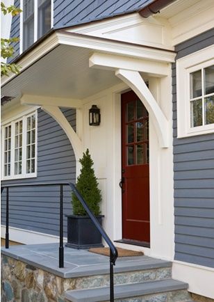 Now here's a gray and white exterior combo that we really love - the deep maroon red entry door livens up an otherwise understated look. We paint homes in the #Bellingham WA area, including front doors. http://www.northpinepainting.com Mudroom Entrance Exterior, Front Portico, Front Door Overhang, Porch Renovation, Front Door Awning, Decks Ideas, Portico Design, Door Overhang, Bright House