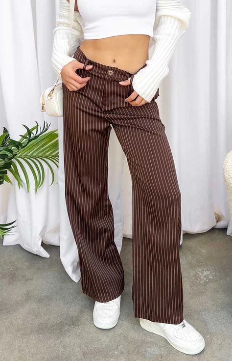 Brown Pinstripe Pants Dress pants are a wardrobe essential when it comes to styling. These brown pinstripe pants are perfect for workwear, going out and everyday! Style with a crop and sneakers to complete this look. Brown Striped Pants Outfit, Brown Pinstripe Pants, Striped Pants Outfit, Stripe Pants Outfit, Wide Leg Pants Outfit, Full Length Pants, Brown Pinstripe, Festival Pants, Leg Pants Outfit