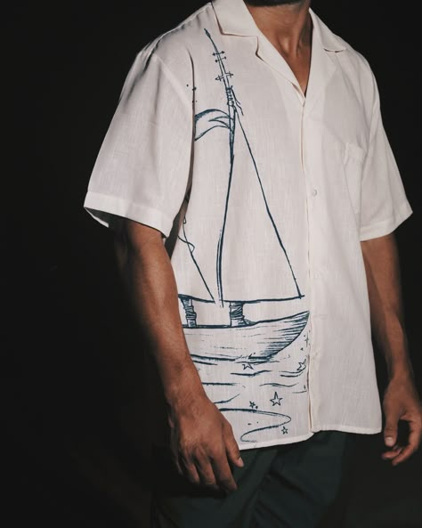 The shirt, adorned with the intricate print of a majestic vessel, embodies the epitome of uniqueness. Unisex Clothing Fashion, Mens Embroidery, Nautical Embroidery, Tshirt Details, Linen Style Fashion, Reap What You Sow, Mens Top, Resort Shirt, Mens Designer Shirts