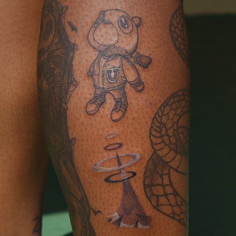 tattoo done at divine torture by @sofi.inks Rare Men Tattoos, Kanye Graduation Tattoo, Kanye West Graduation Bear Tattoo, Kanye West Graduation Tattoo, Kanye West Bear Tattoo, Young Thug Tattoos, Kanye Bear Tattoo, Tattoo Ideas Small Words, Kanye West Tattoo Ideas