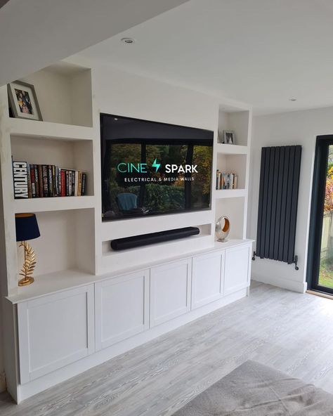 Cine Spark Electrical & Media Walls Limited | Goes to show you don’t always need a fire to create a perfect media wall. We incorporated shaker cupboards into this wall to provide much… | Instagram Tv Media Wall With Storage, Media Wall With Cupboard And Fire, Media Wall Ideas Without Fireplace, Media Wall Storage, Media Wall With Shelves, Media Unit Ideas Tv Walls, Bedroom Media Wall, Shaker Cupboards, Built In Media Wall