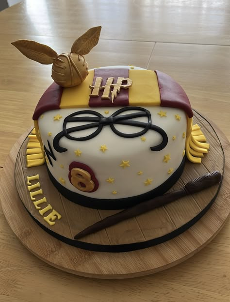 Harry Potter themed cake with the golden snitch,scarf and wand. All handmade . Happy Birthday Cake Harry Potter, Gryffindor Cake Ideas, Harry Potter Cake Ideas Birthdays, Golden Snitch Birthday, Harry Potter Bday Cake, Simple Harry Potter Cake, Easy Harry Potter Cake, Harry Potter Cakes Birthday, Tarta Harry Potter