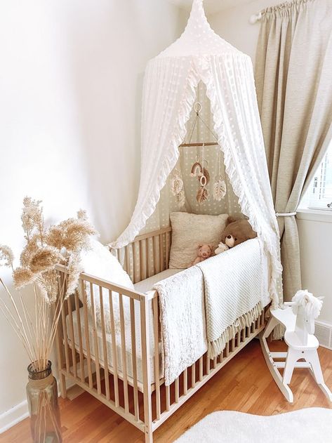 Whimsical boho nursery | Baby girl room decor, Baby crib canopy, Nursery baby room Cribs With Canopy, Minimalist Neutral Nursery, Nursery With Canopy Over Crib, Nursery Crib Canopy, Crib With Mobile, Canopy In Nursery, Canopy For Crib, Nursery With Canopy, Newborn Girl Room