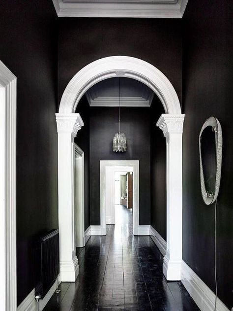 Nov 7, 2019 - Have you ever thought about painting a room in your house black? Maybe a bedroom, bathroom, living, or dining room? We have painted 2 rooms in our home black and I LOVE the moody look it creates. Making the Decision to Paint Walls Black Making the decision to paint a room black is a big… Continue reading → Arched Doorways, Brunswick House, Hallway Light Fixtures, Shelves Design, Shelf Mantle, Black Rooms, Black And White Interior, Black Room, Dark Walls