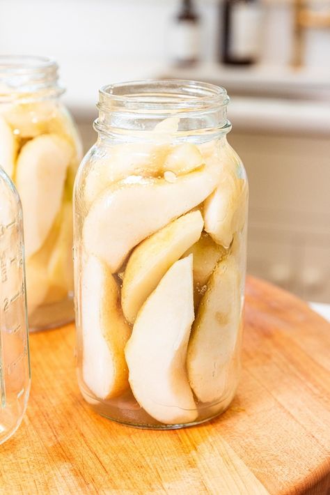 If you're looking for a straightforward, easy canning recipe, then this recipe for how to can pears is the one for you! A simple syrup is poured over sliced pears, and into the water bath they go. A few minutes later, the pears are ready to go for months to come! | wyseguide.com #canning #recipe #pears #preserving #fall Fig Perserves Recipes, Pear Canning, How To Can Pears, Freezer Apple Pie, Can Pears, Pear Pie Filling, Freezer Apple Pie Filling, Peach Jalapeno Jam, Pear Recipes Easy