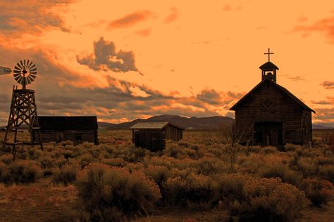 Image chosen to depict possible environmental features/decoration, here a windmill and a church and outhouses. Wild Western Aesthetic, Old West Aesthetic, Rdr2 Oc, Dark Western, Gothic Western, Cowboy Aesthetic, Bg Design, Western Town, Wilde Westen