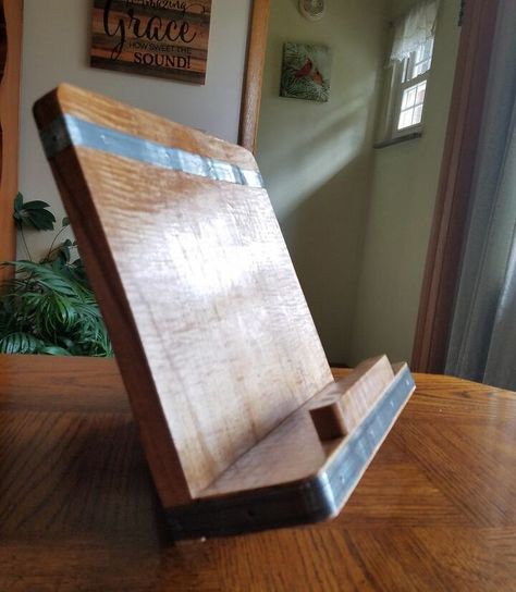 Awhile back I saw a really cool reclaimed wood cookbook/tablet stand advertised in a catalog. But the $110 price tag was a big "no, thanks" for me. Here is a tutorial on my version with plenty of options for you to customize a couple of your own.All of the materials used were on hand, so there was no cost involved other than an afternoon of our time. In the complete blog, I offer tons of suggestions for alternate materials, trim and finishes. Check it out! Cookbook Stand Diy, Diy Tablet Stand, Diy Recipe Book, Recipe Book Stand, Diy Cookbook, Water Based Wood Stain, Salvaged Furniture, Cookbook Holder, Cook Book Stand