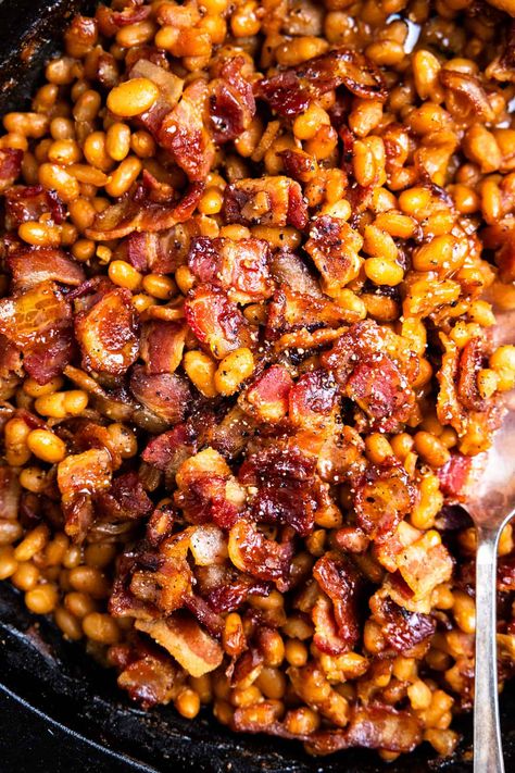 Seriously the BEST Smoked Baked Beans full of deep rich flavor, with a spicy, sweet taste. These beans are mixed with molasses and light brown sugar and topped with crispy bacon. It all cooks in a smoker to give a bold smoky flavoring that will pair with all your favorite BBQ dishes. This recipe is easy to make in your electric smoker or Traeger. So quick and easy to make this from scratch recipe using canned or dried beans. Side Veggies, Lunch Casserole, Bake Beans, Bbq Foods, Easy Baked Beans, Baked Beans With Bacon, Bbq Baked Beans, Bbq Beans, Baked Bean Recipes