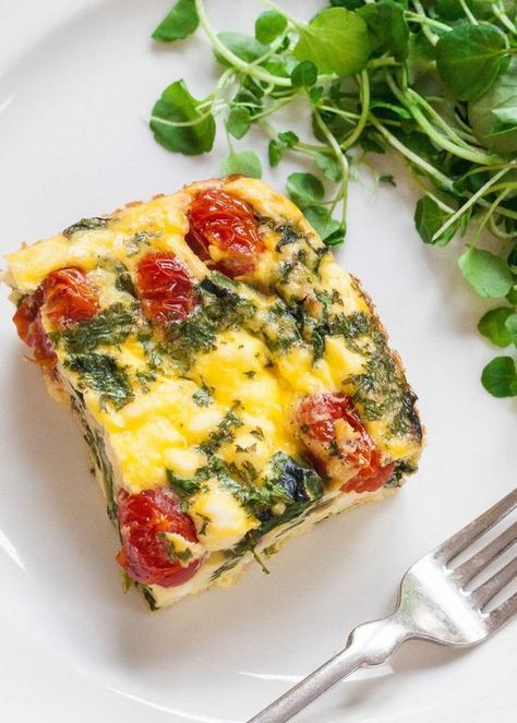 Frittata Squares with Spinach, Tomatoes, and Feta Recipe | SimplyRecipes.com Tomatoes And Feta Cheese, Tomato Frittata, Tomato And Feta, Tomatoes And Feta, Spinach Tomato, Spinach Feta, Frittata Recipes, Spinach And Cheese, Spinach And Feta