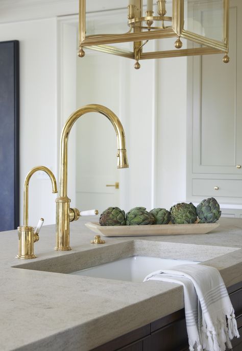 A perfect blend of simple Rockwood limestone countertops and polished brass fixtures elevates this kitchen island to the next level. #tritonstone #tritonstonegroup Limestone Countertops Kitchen, Limestone Countertops, Terrazzo Design, Countertop Surfaces, Tile Countertops, Countertops Kitchen, Countertop Design, All White Kitchen, Emily Henderson