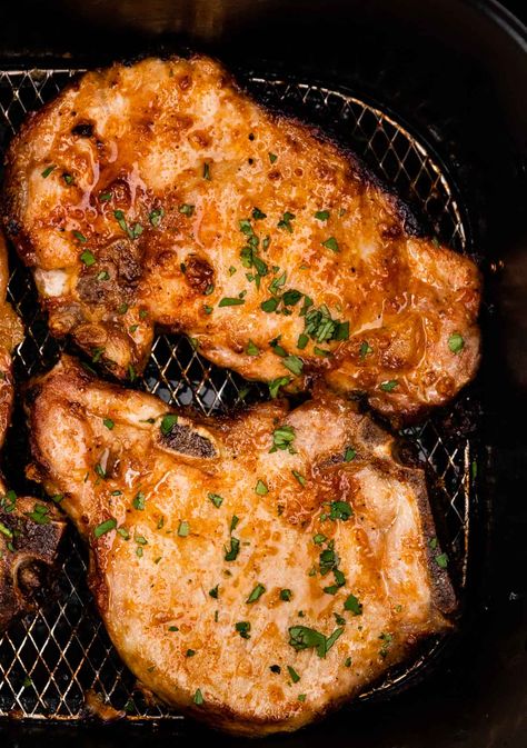 Easy Air Fryer Garlic Butter Pork Chops Recipe - Dinner, then Dessert Bone In Pork Chop Recipe Air Fryer, Air Fry Bone In Pork Chops, Thick Cut Pork Chops Air Fryer, Air Fried Pork Chops Bone In, Airfry Pork Chop Recipes, Pork Chops In The Air Fryer, Air Fryer Bone In Pork Chops, Air Fried Pork Chops Boneless, Air Fryer Pork Chops Bone In