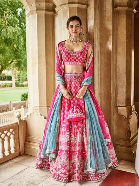 Gorgeous hot pink lehenga with blue dupatta. See more on wedmegood.com  #wedmegood #indianwedding #indianbride #lehenga #lehengacholi #bridallehenga #bridallehengacholi #pink #blue Lehenga Color Combinations, Orang India, Indian Outfits Lehenga, Lehnga Dress, Bridal Lehenga Collection, Indian Bridal Lehenga, Designer Bridal Lehenga, Anita Dongre, Gaun Fashion