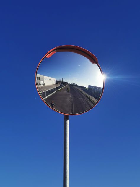 A photo of a street mirror with blue sky in the background Street Mirror, Circle Photography, Street Lifestyle, Mirror Illustration, Concave Mirrors, Bike Mirror, Branding Moodboard, Ghost Party, Mirror Photography