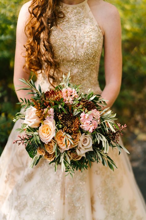 LOVE a bridal gown with gold accents. Beautifully paired with muted fall tones and photographed by Megan Antelek. #wedding #weddingbouquet #bride #bridalbouquet #goldaccents #goldweddinggown #fallwedding #fallflowers Flowers With Gold Dress, Golden Wedding Bouquet, Gold Wedding Flowers, Gold Wedding Gowns, Natural Bouquet, Gold Bouquet, Golden Gown, Copper Dress, Bronze Dress