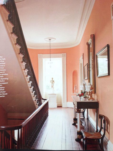 Peach walls and elegant staircase Gil Schafer, Peach Walls, American House, Entry Hall, Wood Trim, Hallway Ideas, Living Room Paint, Room Paint, Entry Way