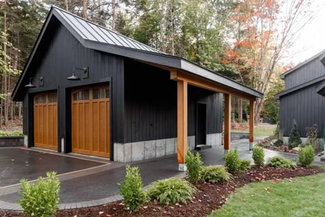 Black Garage With Wood Doors, Driveway To Backyard Garage, Black Outbuilding, Pole House Designs, Garage Shop Ideas Workshop, Black Metal Garage Buildings, Black Garage Exterior, All Black Garage, Garage Ideas Exterior