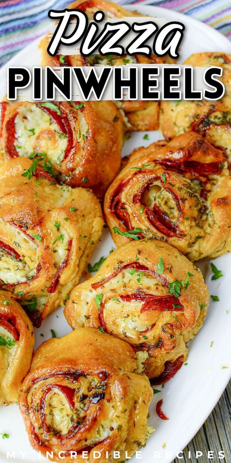 Super easy and delicious pizza pinwheels are the perfect Super Bowl Sunday appetizer, game day snack, or even just a nice appetizer that's not related to football. These pinwheels are super easy to make and are filled with all the best pizza flavors that we all love. Pizza pinwheels are made with canned crescent rolls, pepperoni, pizza sauce, and mozzarella cheese. They're perfect for a quick snack or appetizer and are sure to become fast favorites. Try them today! Pinwheel Dinner Recipes, Snack Board Dinner, Cresent Roll Recipes Pinwheels, Appetizer Meals Dinners, Simple Summer Recipes Dinner, Pepperoni Rolls With Crescent Rolls, Crescent Roll Pizza Rolls, Crescent Roll Pinwheel Recipes, Potluck Pinwheels