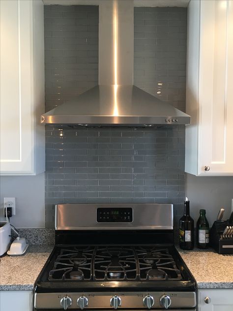 Our kitchen reno! Glass backsplash behind the gas stove and range hood. Backsplash Behind Range, Behind Stove Backsplash, Kitchen Herringbone, Chevron Backsplash, Stove Range Hood, Trendy Kitchen Backsplash, Stove Backsplash, Steel Backsplash, Beadboard Backsplash