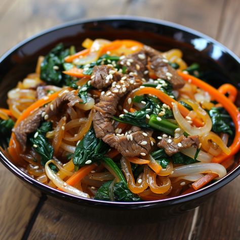 🍜 Dive into the delicious Chapchae! 🍲✨ #Chapchae #KoreanNoodles Chapchae (Sweet Potato Noodles with Stir Fried Vegetables) Ingredients: Sweet potato noodles (8 oz) Beef, thinly sliced (1/2 lb) Spinach, blanched (1 cup) Carrot, julienned (1) Onion, sliced (1) Bell pepper, sliced (1) Garlic, minced (2 cloves) Soy sauce (3 tbsp) Sesame oil (1 tbsp) Sugar (1 tbsp) Sesame seeds (1 tbsp) Vegetable oil (for cooking) Instructions: Cook sweet potato noodles according to package instructions; set a... Korean Noodle Dishes, Korean Noodles, Twisted Recipes, Sweet Potato Noodles, Cooking Sweet Potatoes, Vegetable Stir Fry, Trending Recipes, Food Babe, Cooking Instructions