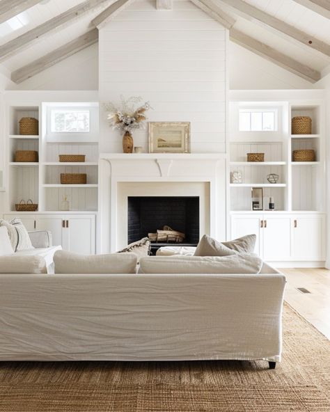 This living room totally captures the modern farmhouse vibe I love! With its vaulted ceilings and shiplap walls, it feels open and airy, but still super cozy. The built-in shelves around the fireplace? Such a great way to add a personal touch with your favorite decor, while keeping everything organized. I’m all about the mix of soft neutrals and textured accents that give the space warmth without feeling cluttered. Plus, with those big windows letting in all that natural light, it’s the perfe... Built In Shelves Living Room Fireplace With Windows, Built In Shelves Living Room Fireplace Windows, Windows Above Built Ins, Built Ins Around Fireplace Vaulted Ceiling, Living Room Built In With Windows, Vaulted Ceiling Living Room Built Ins, Living Room Decor Vaulted Ceiling, Built In Tv Wall Unit Vaulted Ceiling, Vaulted Ceiling Living Room Tv Wall