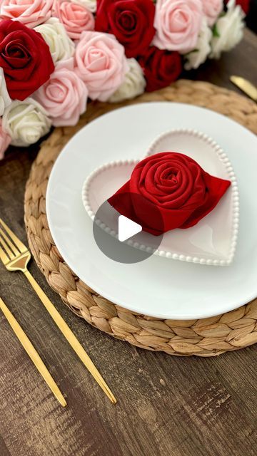 Elle Vautour - Home & Holiday Style on Instagram: "Add a floral flair to your Valentine’s Day tablescape 🌹💖 Watch as ordinary napkins bloom into elegant roses, adding a touch of floral enchantment and romance to your valentine’s tablescape. 🍽️✨ Who knew rose napkin folding could be so easy?  #tablesetting #tablescapes #valentinetablescape #valentinestablescape #valentinedecor #napkin #napkinfolding #vdayinspo #valentineinspo #tabledecor #rosenapkin #tablestyling  #valentinedinner" Rose Napkins Folding, Napkin Folding In Wine Glasses, How To Make A Rose Out Of A Napkin, How To Fold A Napkin Into A Rose, Napkin Folding Ideas Valentines Day, Napkin Flowers Folding, Valentine Napkin Folding, Cute Napkin Folds, Flower Napkin Folding