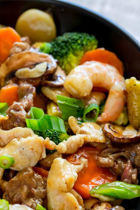 This Happy Family Stir Fry recipe is a wonderful combination of beef, chicken and shrimp, all cooked in one pot with fresh veggies and a Chinese sauce. It is easy to make at home and tastes so much better than a takeout. Paired with steamed rice it is a healthy weeknight meal.  #Chinese #takeout #stirfry #easyrecipe #easydinner  #chineserecipe #takeout #simpledinner Happy Family Chinese Recipe, Shrimp Asian, Happy Family Recipe, Chinese Sauce, Homemade Chinese Food, Chinese Stir Fry, Homemade Chinese, Asian Stir Fry, Chinese Cooking Wine