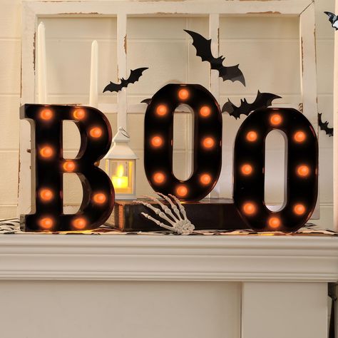 PRICES MAY VARY. Halloween Decor--BOO letter light features a classic black casing with vibrant orange bulbs,perfectly capturing the spooky yet fun spirit of Halloween. Durable Quality--Letter Light Made from sturdy plastic.Size approx (H x W x D ) " 8.5" x 6.3" x 1.5", requires 2 AA batteries(not included). Easy to Use--Light features built-in hanging holes for effortless wall mounting and an easy-to-access on/off switch on the back. Perfect Glow--The orange bulbs emit a soft,inviting glow that Halloween Patio Decor, Cozy Living Room Christmas, Room Halloween Decor, Porch Halloween Decor, Hygge Diy, Living Room Halloween Decor, Table Christmas Tree, Living Room Halloween, Halloween Decor Cute