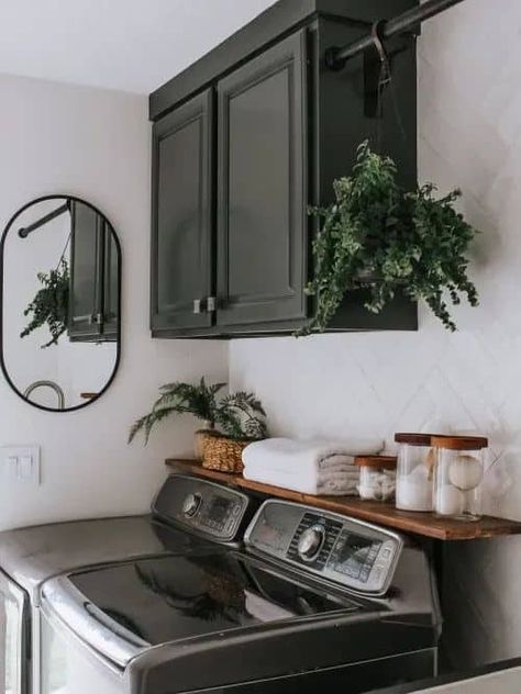 Paint Ideas For Laundry Room, Over Laundry Cabinets, Black And Wood Laundry Room, Laundry Room With Dark Cabinets, Mudroom Ideas Laundry Room, Dark Washer And Dryer Laundry Room, Dark Green Laundry Room Cabinets, Black Cabinet Laundry Room, Small Laundry Room Dark Cabinets