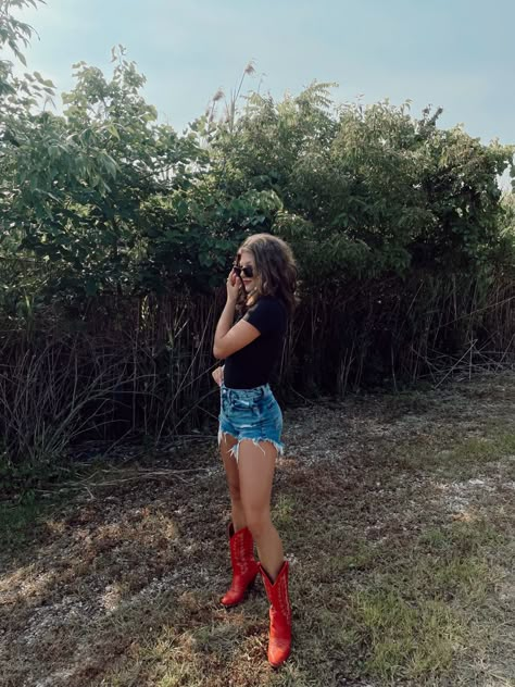 Styling Red Cowgirl Boots, Red Country Boots, Red Boots Concert Outfit, Red Cowgirl Boots Outfit Summer, Tall Red Cowboy Boots Outfit, Flare Jeans And Cowboy Boots, Short Red Cowboy Boots Outfit, Style Red Cowboy Boots, How To Style Red Cowboy Boots