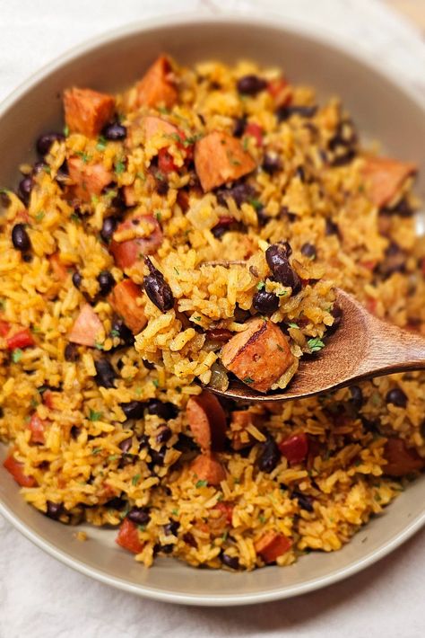 A flavorful and protein packed #onepotdinner loaded with black beans, tomatoes, andouille sausage and rice, perfect for a weeknight.   #onepanmeals #blackbeansandrice #beansandrice #onepotmeal Black Beans And Rice Recipe With Sausage, Sausage Rice Beans, Black Beans Rice And Sausage, Rice Beans And Sausage, Sausage Beans And Rice Recipes, Beans Rice And Sausage, Sausage And Black Beans, Andouille Sausage And Rice, Sausage Beans And Rice