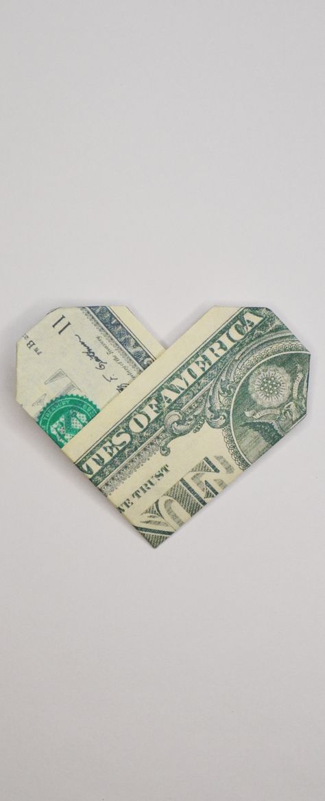 The money heart is an easy origami out of one dollar bill. Without using glue or tape. It's a nice gift for Valentine's day! Do you like this origami? I wish you a pleasant viewing! Subscribe to my channel! Paper Hearts Origami Aesthetic, Dollar Bill Heart How To Make, Money Origami Easy Numbers, Orgamini Money, Money Heart Origami How To Make, Money Origami Heart Step By Step, Money Heart Aesthetic, How To Make A Heart Out Of A Dollar, 5 Dollar Bill Origami