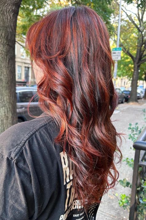 Woman with auburn brown hair and red highlights. Red Hair With Highlights Balayage, Red Highlight On Brown Hair, Red Peaks Boo Hair, Burgundy Wine Highlights, Red Hair Red Highlights, Red Brown Highlights On Dark Hair, Dark Brown Hair With Strawberry Blonde Highlights, Highlights For Reddish Brown Hair, Burgandy Hair Highlight