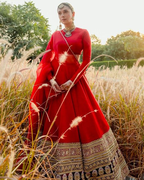 Taking to her IG handle, Aditi Rao Hydari has shared some gorgeous photos from her second wedding soiree, and for the same, she slipped into a simple yet eye-striking lehenga from the famous designer, Sabyasachi Mukherjee. Sabyasachi recently shared the details about Aditi’s oh-so-classy lehenga. Made in the hue of traditional brides, which is red, the lehenga’s fabric was silk and had board embroidery at the bottom featuring several handcrafted patterns. The actress teamed her lehenga with a... Red Bottom Outfits, Sabyasachi Lehengas, Aditi Rao Hydari, Sabyasachi Bride, Aditi Rao, Sabyasachi Lehenga, Bridal Mehendi Designs, Bridal Lehenga Red, Red Lehenga