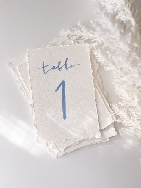 Custom Table Numbers, Hand Torn Deckled Edge Table Numbers, Hand Painted Table Numbers on Textured Paper, Watercolor Table Numbers - Etsy Cape Cod Table Numbers, Table Numbers Wedding Acrylic Painted Back, Table Card Numbers, Different Table Numbers Wedding, Blue And White Table Numbers, Wedding Diy Table Numbers, Watercolor Wedding Table Numbers, Subtle Blue Wedding, Handwritten Table Numbers