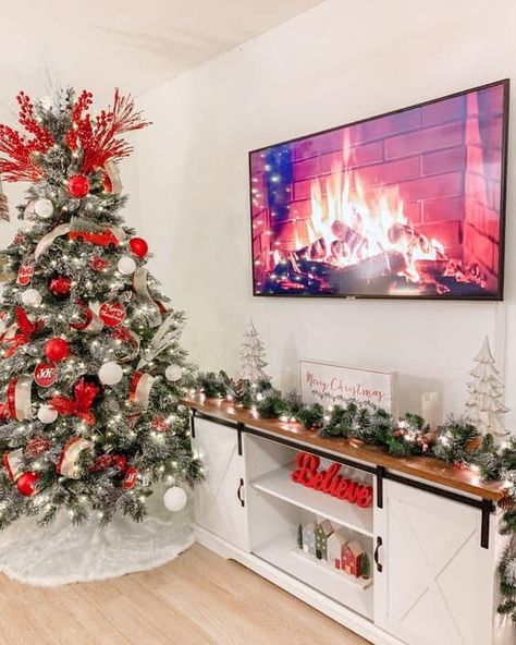 20 Christmas TV Stand Styling Ideas » Lady Decluttered Cute Christmas House Decor, Christmas Decor Under Tv Stand, Tv Decor Christmas, Christmas Tree Next To Tv Stand, Tv Decoration Christmas, Christmas Garland For Tv Stand, Christmas Decor Ideas For Entertainment Center, Garland Tv Stand Christmas, Christmas Decor Ideas For Living Room Farmhouse