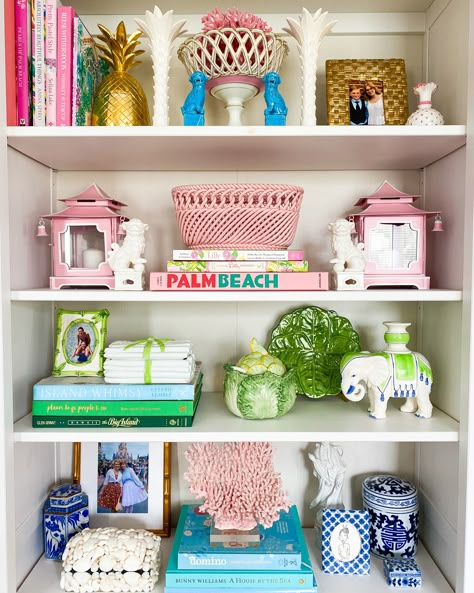 Grand Millennial Bookshelf, Colorful Shelf Styling, Unique Bookshelf Decor, Preppy Home Decor Living Room, Preppy Bookshelf Decor, Feminine Library Room, Maximalist Shelf Styling, Living Room Bookcase Decor, Colorful Shelf Decor