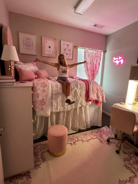 Pink Coquette Dorm Room, Pink And White College Dorm, Pink And Purple Dorm Room, Loveshackfancy Dorm Room, University Of Arkansas Dorm Room, Love Shack Fancy Dorm Room, Pink And Gold Dorm Room Ideas, Dorm Inspo Cozy Pink, College Dorm Decor Aesthetic