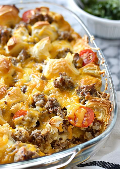 Whip up an effortless gourmet breakfast with our Overnight Croissant Breakfast Casserole! It combines flaky croissants, savory sausage, and rich cheese in a make-ahead dish that simplifies morning routines. Perfect for brunch or special occasions, it's a crowd-pleaser that leaves everyone asking for seconds. Prep tonight, bake tomorrow, and watch it disappear! Ready for a breakfast revolution? Save this recipe now and give your mornings a delicious upgrade! Easter Breakfast Casserole Overnight, Make Ahead Breakfast Croissant, Make Ahead Breakfast Crescent Rolls, Cheesy Sausage And Croissant Casserole, Overnight Crescent Roll Breakfast Casserole, Sausage Breakfast Casserole With Croissant, Christmas Croissant Breakfast Casserole, Overnight Breakfast Casserole Recipes, Sausage Egg And Cheese Casserole With Croissant