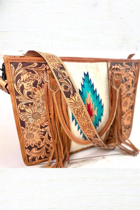 OUR HANDBAGS SPEAK LOUDER THAN WORDS! Our mission is to bring high quality, handmade products at an affordable price to our customers. American Darling Turquoise Aztec Southwest Saddle Blanket Hand Tooled Leather Bag This stunning woven and hand tooled leather bag is sure to complete any look and turn all the heads! Western Bags, Concealed Carry Purse, Tooled Leather Bag, Leather Patterns, Western Purses, Saddle Blanket, Bags Ideas, Leather Floral, Hand Tooled Leather