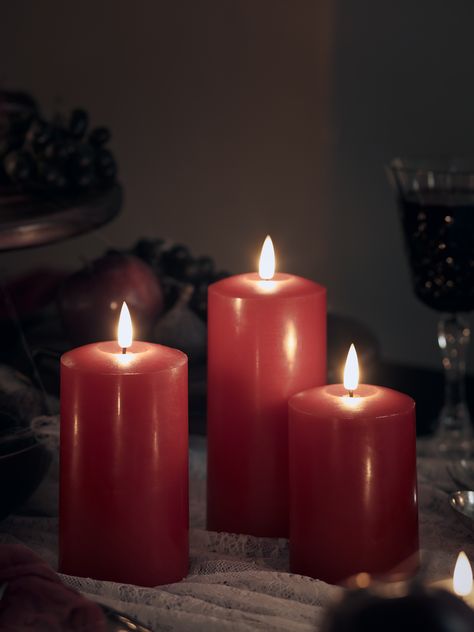 Red LED Halloween pillar candles as part of a Halloween dining display. Halloween Candle Decor, Festive Garland, Halloween Lighting Outdoor, What Is Halloween, Led Pillar Candle, Real Flame, Selling Candles, Halloween Candles, Halloween Lights