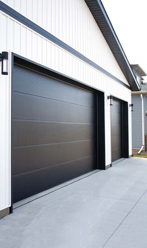 Flush Panel Residential Garage Door | Midland Garage Door Garage Door Panels Ideas, Modern Farmhouse Garage Door Ideas, Shop House Front Doors, Black And White Garage Doors, Modern Garage Door Hardware, Garage Doors No Windows, Black Metal Garage Door, Modern Garage Door Styles, Up And Over Garage Door